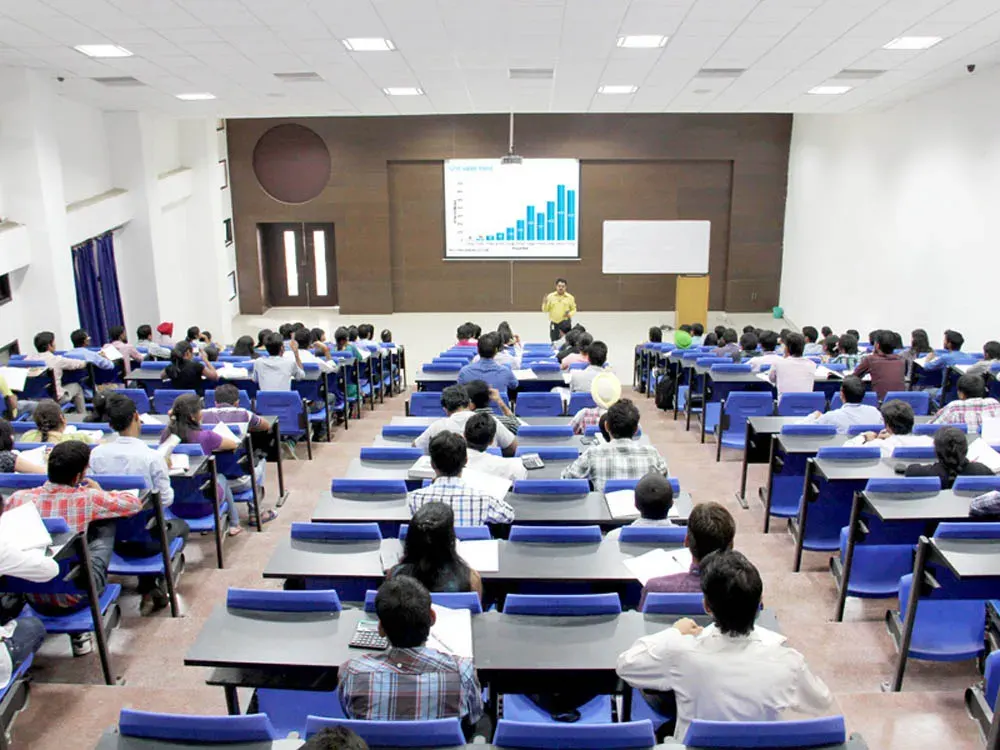 Students attending a lecture in a tiered classroom at LPU