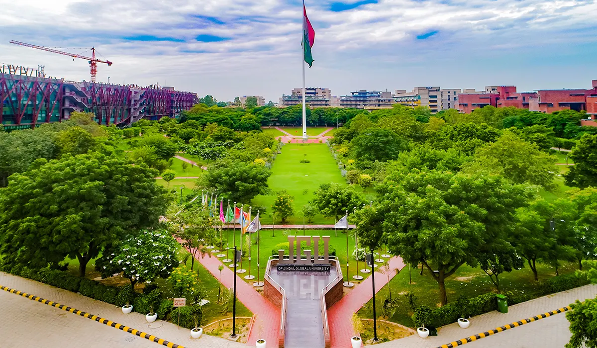 Aerial view of the tree-lined central lawn and flagpole at O.P. Jindal Global University